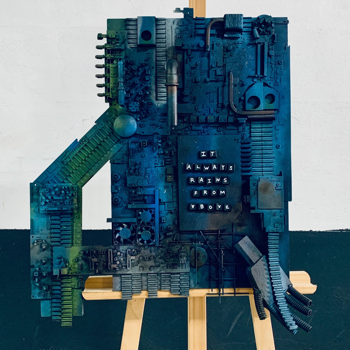 Mixed-media artwork assembled from electronic components and found materials.